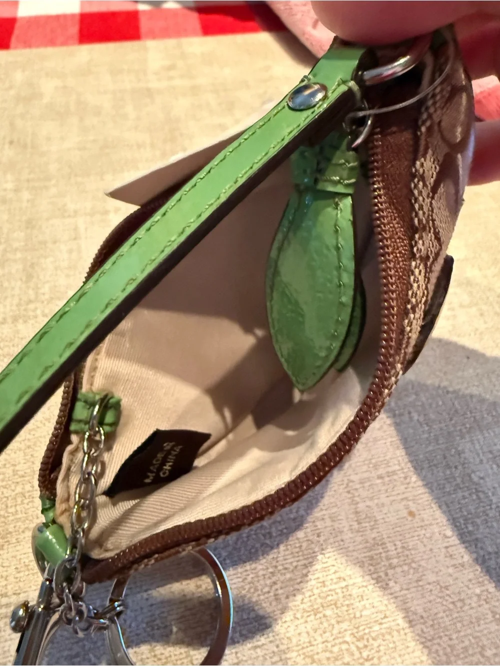 Coach Brown Signature Wristlet with Green Trim and Daisy Motif